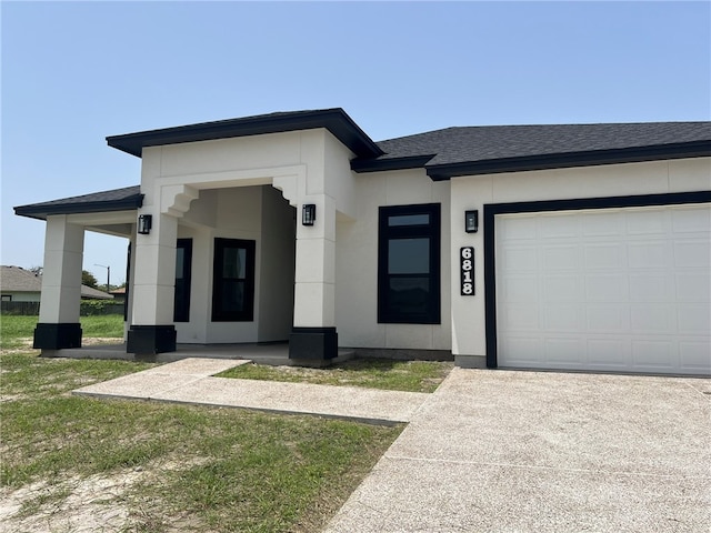 view of front of property with a garage