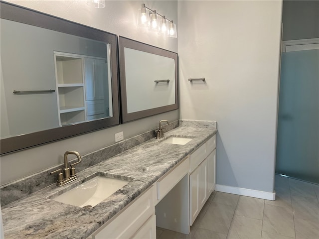 bathroom with tile patterned floors and vanity