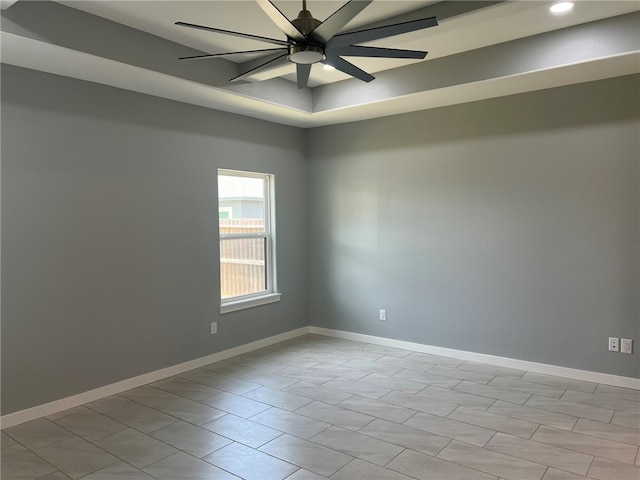 unfurnished room featuring ceiling fan and light tile patterned floors