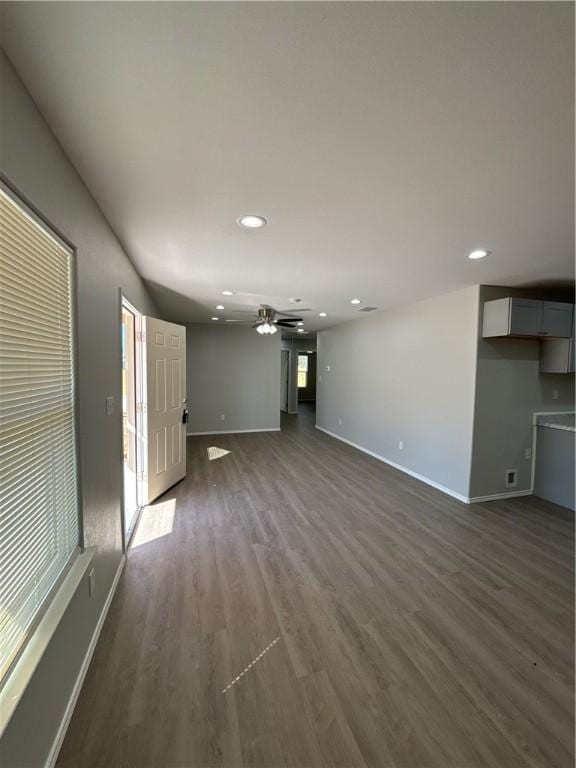 110 Josephine St, Corpus Christi, TX 78401 - unfurnished living room with baseboards, dark wood-type flooring, recessed lighting, healthy amount of natural light, and ceiling fan