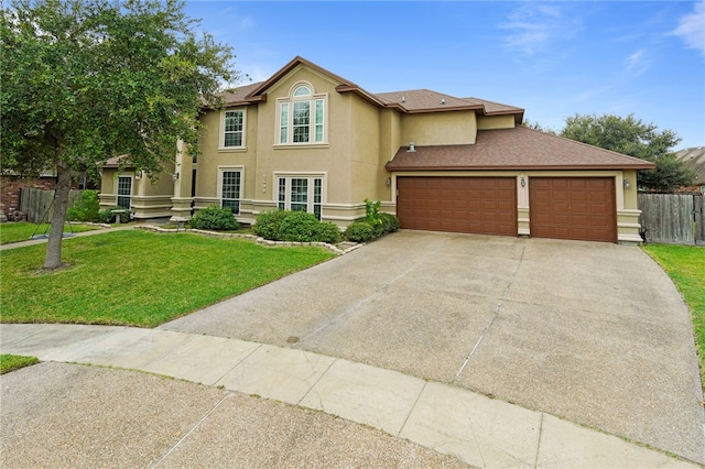 view of front of house with a front lawn and a garage