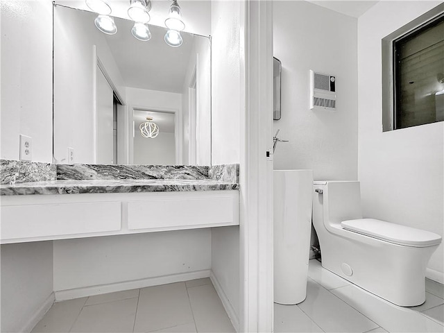 bathroom with tile patterned flooring, toilet, and vanity