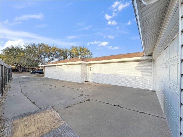 garage with fence