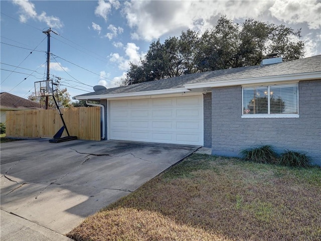 garage featuring a lawn