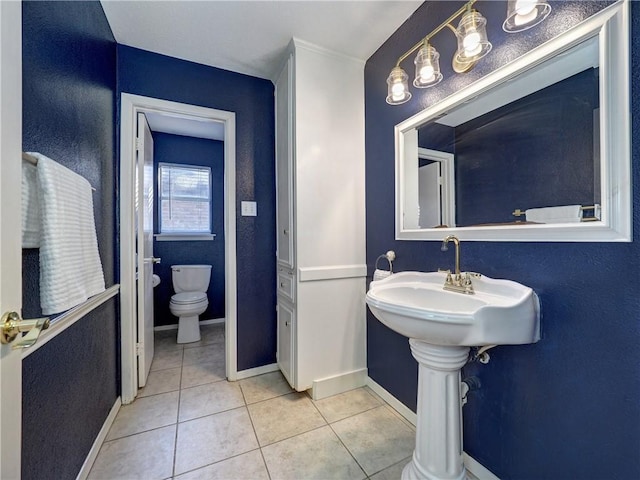 bathroom featuring tile patterned floors and toilet