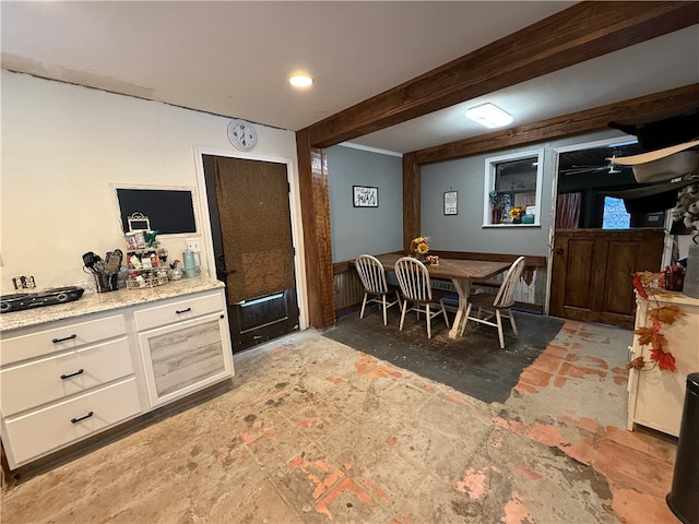 dining room with beamed ceiling