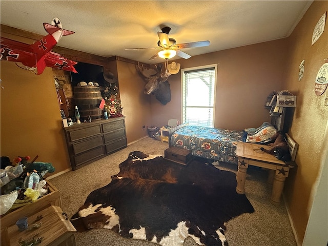 bedroom with ceiling fan and carpet floors