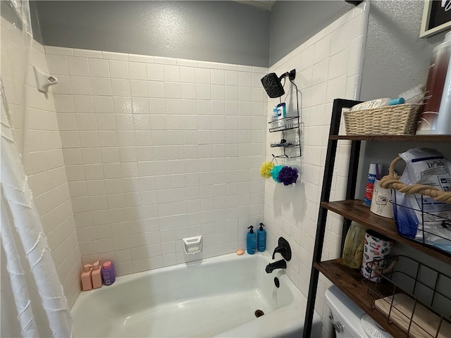 bathroom with shower / bath combo