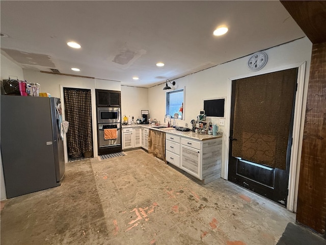 kitchen featuring appliances with stainless steel finishes and white cabinetry