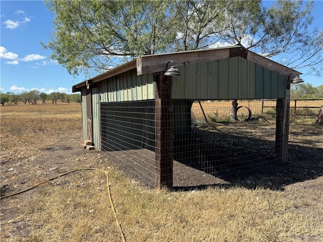 view of outbuilding featuring a rural view