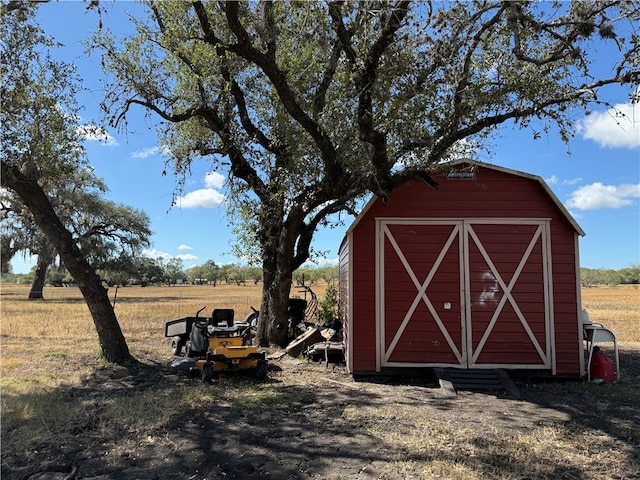 view of outdoor structure with a rural view