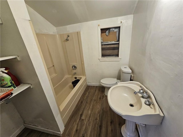 bathroom with toilet, hardwood / wood-style flooring, and sink