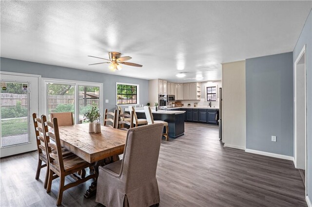 10946 Birdwood, Corpus Christi, TX 78410 - dining space with dark wood-style floors, baseboards, and ceiling fan