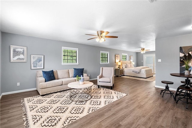 10946 Birdwood, Corpus Christi, TX 78410 - living area with a ceiling fan, wood finished floors, and baseboards