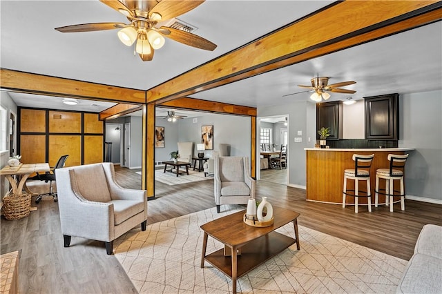 10946 Birdwood, Corpus Christi, TX 78410 - living room with a ceiling fan, baseboards, wood finished floors, and beamed ceiling