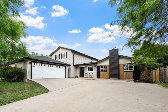 10946 Birdwood, Corpus Christi, TX 78410 - view of front of house with driveway, an attached garage, and fence