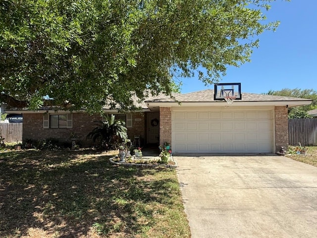 ranch-style home with driveway, a garage, and brick siding