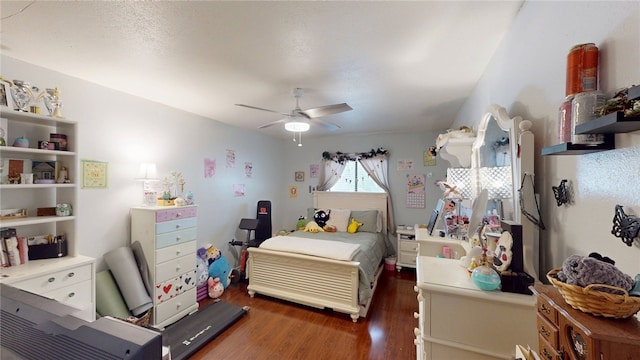 bedroom with a ceiling fan and wood finished floors