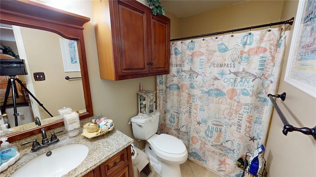 bathroom featuring toilet, tile patterned floors, vanity, and a shower with shower curtain