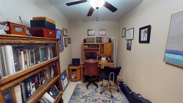 office area with carpet floors and ceiling fan