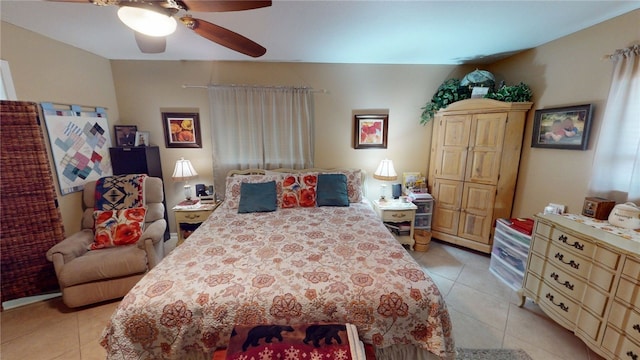 bedroom featuring light tile patterned flooring and ceiling fan