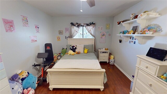 bedroom featuring a ceiling fan, baseboards, and dark wood-style floors