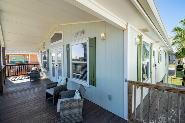 wooden terrace with a porch