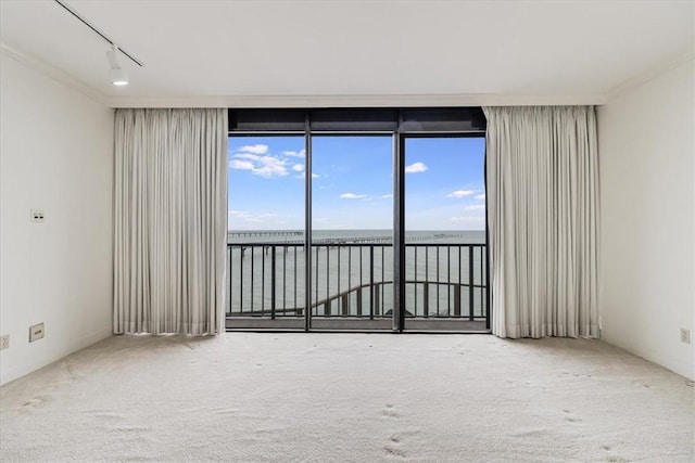 4350 Ocean Dr Unit 103, Corpus Christi, TX 78412 - carpeted empty room featuring a wall of windows and a water view
