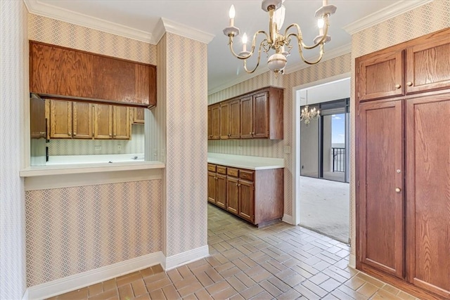 4350 Ocean Dr Unit 103, Corpus Christi, TX 78412 - kitchen featuring crown molding, light countertops, wallpapered walls, a notable chandelier, and brick floor