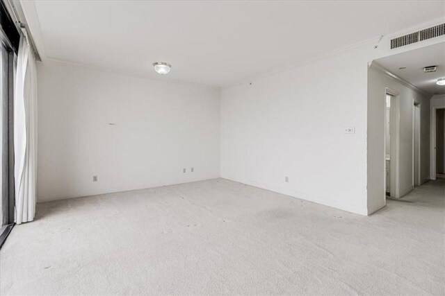 4350 Ocean Dr Unit 103, Corpus Christi, TX 78412 - empty room featuring visible vents, ornamental molding, and light carpet