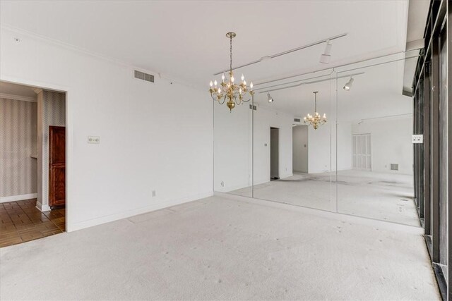 4350 Ocean Dr Unit 103, Corpus Christi, TX 78412 - empty room featuring ornamental molding, a notable chandelier, baseboards, and visible vents
