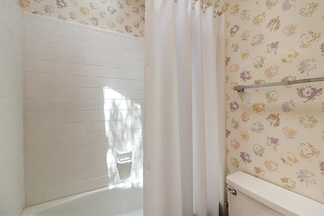 bathroom with toilet and shower / bathtub combination with curtain