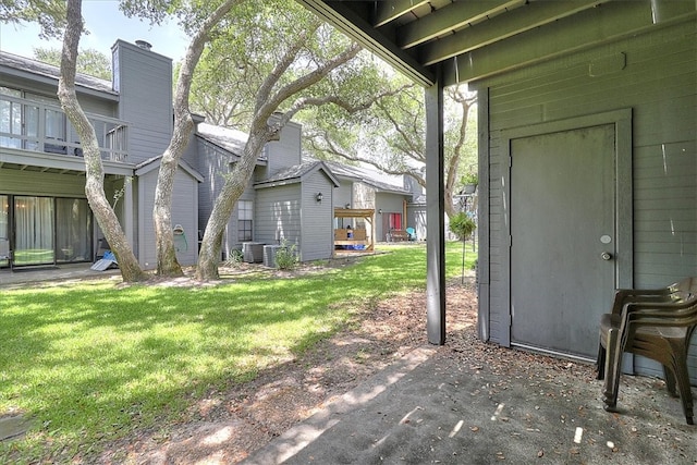 view of yard with central AC