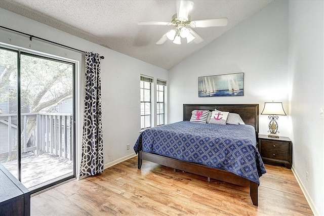 bedroom featuring a textured ceiling, access to exterior, lofted ceiling, ceiling fan, and light hardwood / wood-style flooring