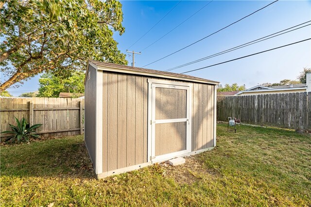 view of outdoor structure with a lawn