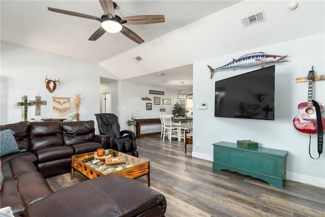 living room featuring a ceiling fan, lofted ceiling, visible vents, and wood finished floors