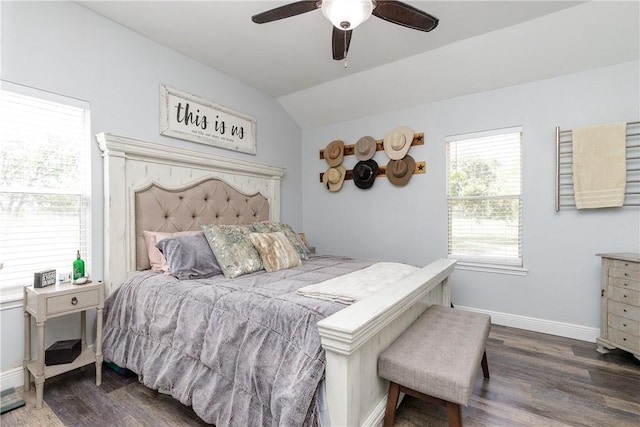 bedroom featuring a ceiling fan, vaulted ceiling, baseboards, and wood finished floors