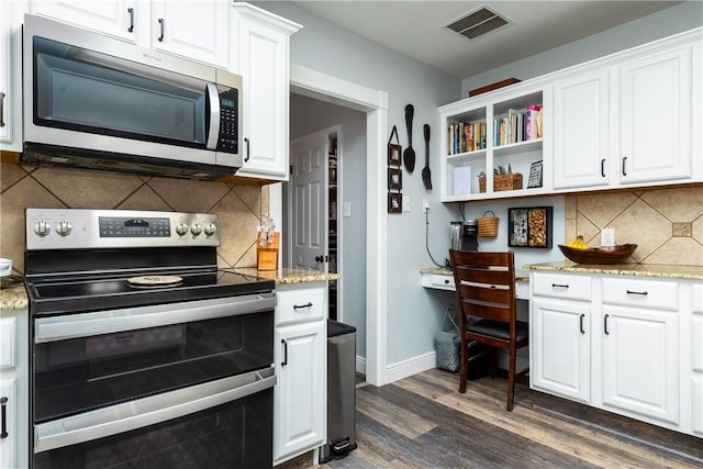 kitchen with white cabinetry, visible vents, appliances with stainless steel finishes, and dark wood-style flooring