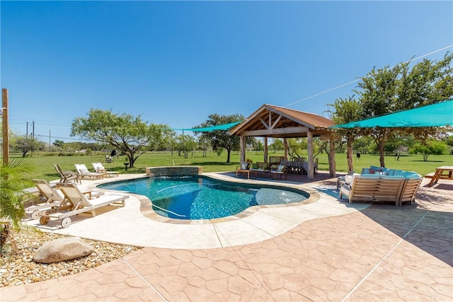 outdoor pool with a patio area, a lawn, and a gazebo