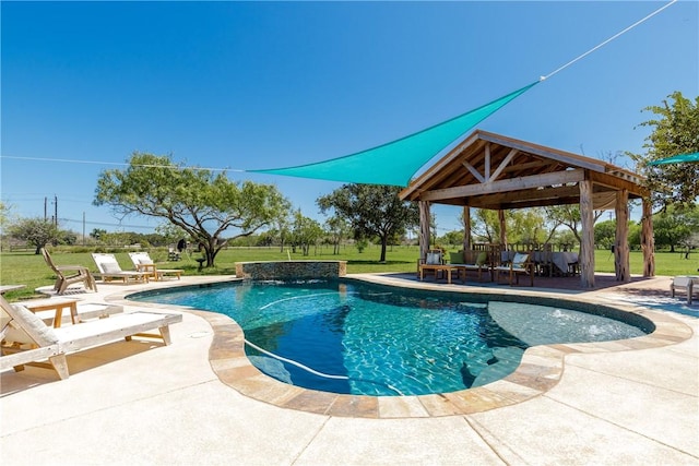 outdoor pool with a patio area, a lawn, and a gazebo