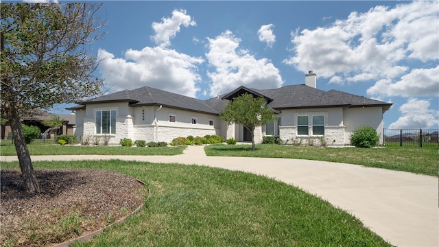 prairie-style house with a front lawn