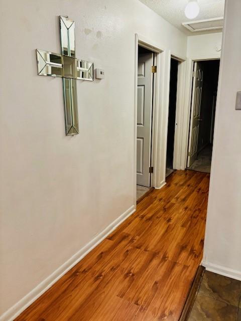 1125 Woodlawn Dr, Corpus Christi, TX 78412 - hall featuring baseboards and wood finished floors