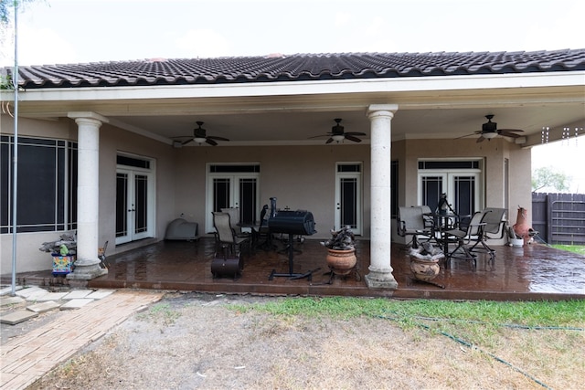 view of patio featuring french doors and ceiling fan