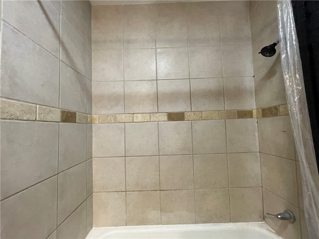 details with shower / bath combination with curtain