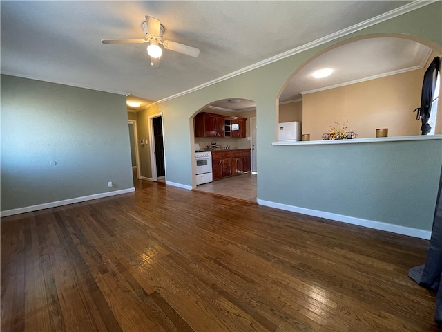 unfurnished living room featuring dark hardwood / wood-style flooring, ceiling fan, and crown molding