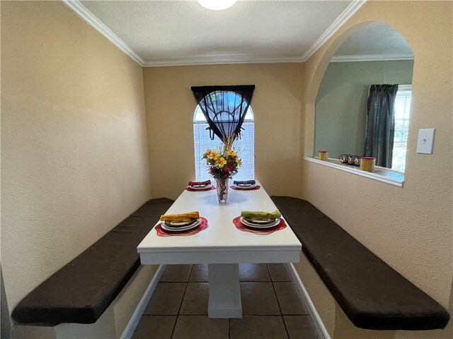 tiled dining area with ornamental molding