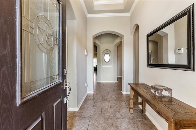 tiled foyer with ornamental molding