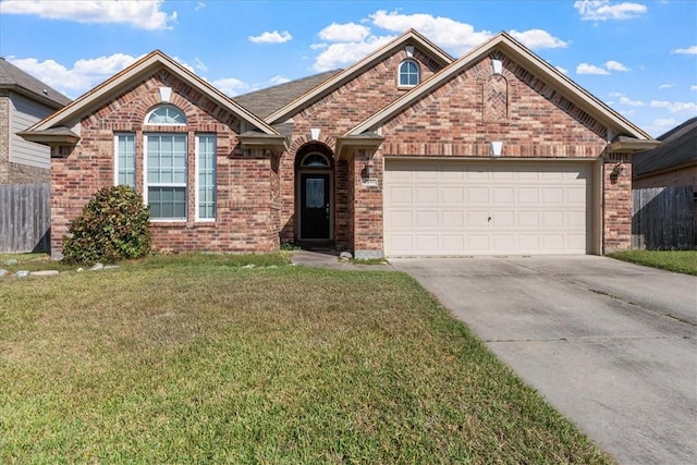 front facade featuring a garage and a front yard