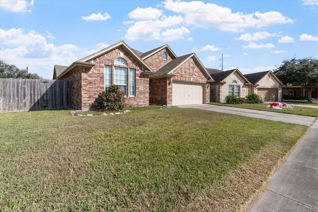 view of front of house featuring a front yard and a garage