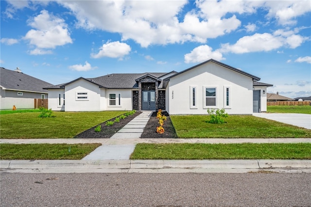 ranch-style house featuring a front lawn